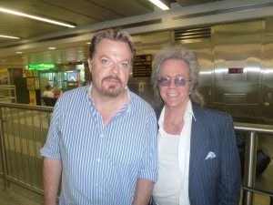 Jeffrey Gurian and Eddie Izzard waiting for their bags at baggage claim at La Guardia airport in NYC!