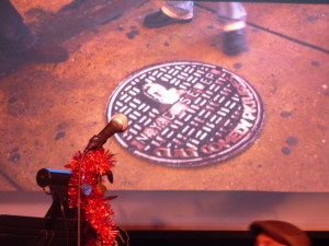 The manhole cover in it's proper place in Times Square!